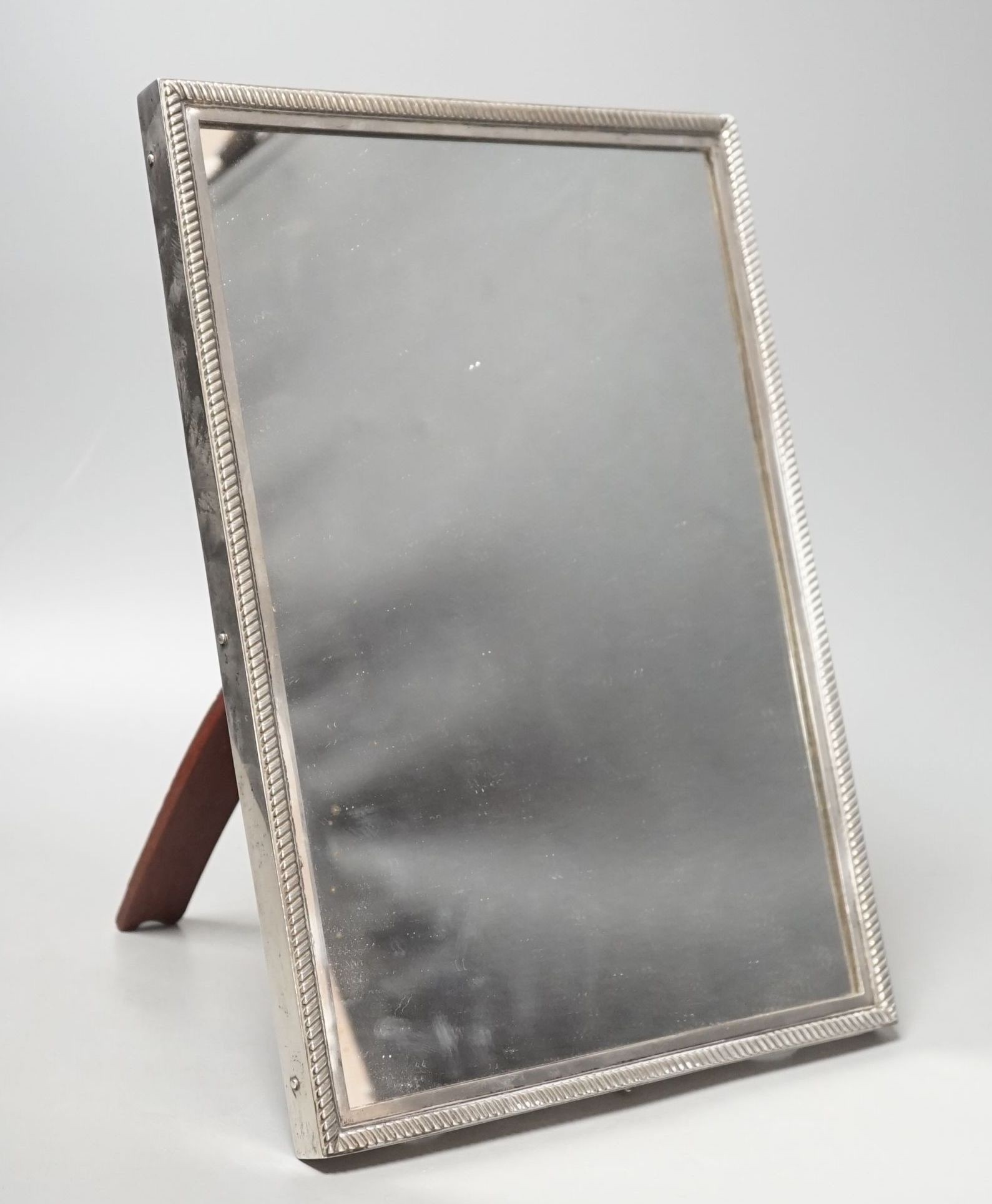 An early 20th century Russian 84 zolotnik mounted rectangular easel mirror, 33.4cm.